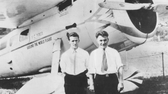 Wiley Post (right) and Harold Gatty with their record-setting plane in 1931.