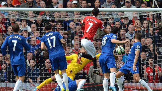 Manchester United's Angel Di Maria fires past Tim Howard.