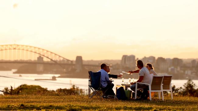 People pictured having a picnic and drinks in Dover Heights in Sydney's Eastern Suburbs. Picture: Damian Shaw