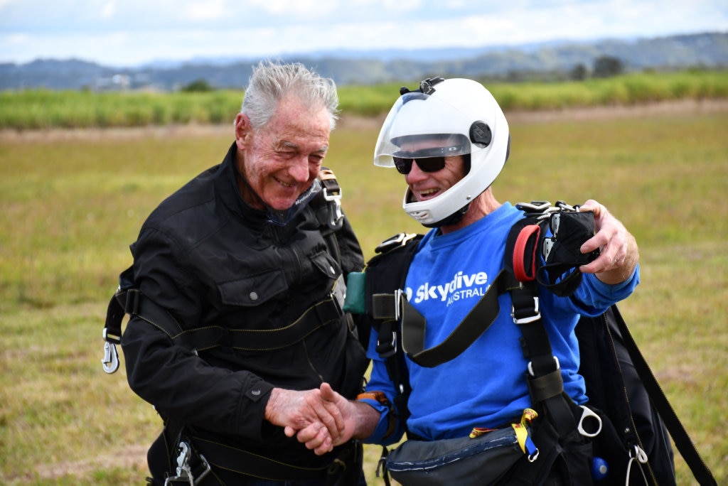 Bob Sherwell, who is about to turn 87, shares his second charity skydive with Pastor Joel Baker, of Flametree Baptist Church.