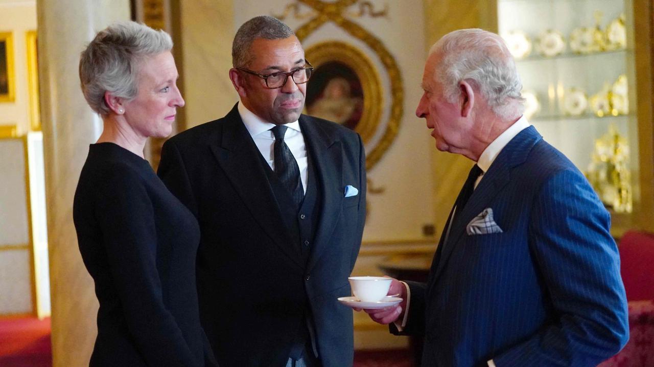 Britain's King Charles III speaks with Britain’s Foreign Secretary James Cleverly, centre, during a reception with Realm High Commissioners and their spouses in the Bow Room of Buckingham Palace in London on September 11, 2022. Picture: AFP