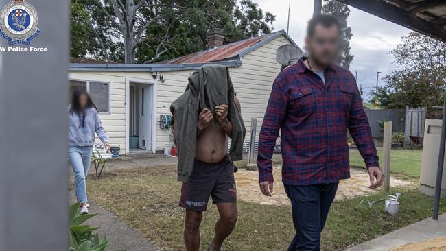 Police arrested 37-year-old Rydalmere man Shanel Tofaeono (centre) on Thursday morning. Picture: NSW Police