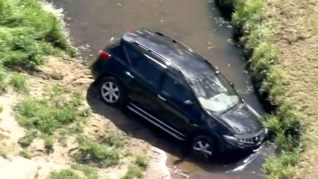 The car Gregory Amble and Mak Muon drove were allegedly in before it got bogged in a creek. Picture: 7 News