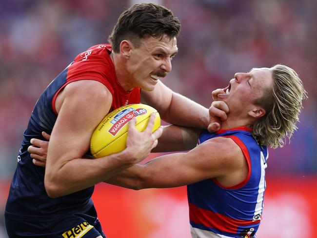 Jake Lever fends off Bulldog Cody Weightman. Picture: Michael Klein