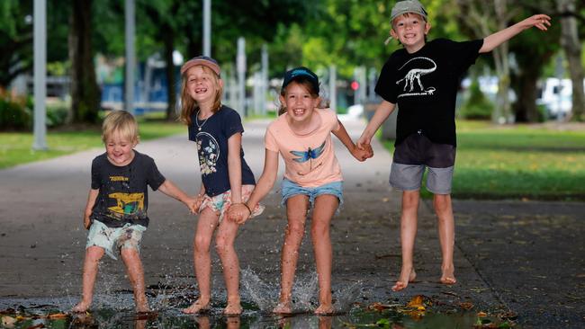 Jonny Jones, 3, manages to have fun no matter what the weather is doing, splashing in puddles along the Cairns Esplanade. Picture: Brendan Radke