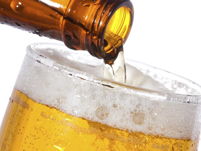 Pouring beer into pot glass. Generic image.