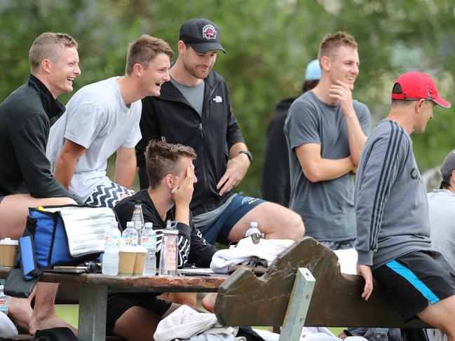 Don Pyke, right, relaxes with his players as the Crows pre-season camp takes them to the Fleurieu Peninsula. Photo: Tait Schmaal