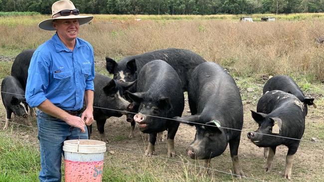 Rob Bauman feeds his pigs at Freckle Farm, Eton.