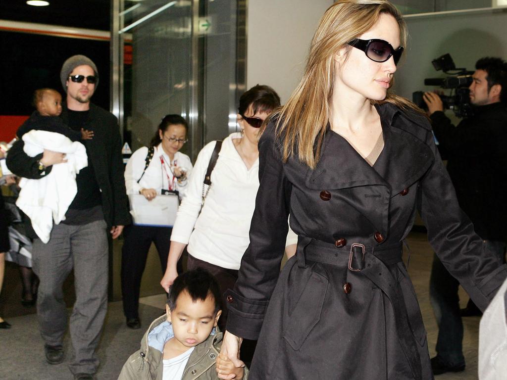 Pictures of the family in airports like this were common. Picture: Yoshikazu Tsuno/AFP