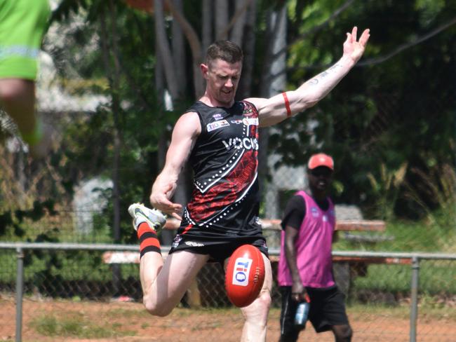 Sam Darley kicks clear against PINT on Bathurst Island. Picture: Alison McGowan.