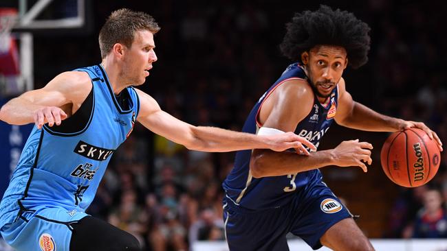 Josh Childress of the Adelaide 36ers, right, looks to drive past Tom Abercrombie of the New Zealand Breakers. Picture: AAP