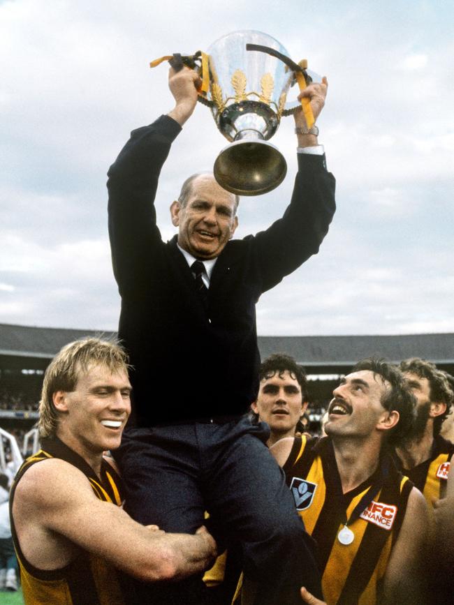 Allan Jeans holds the 1989 Premiership Cup with Peter Curran and John Kennedy Jr. Picture: HWT