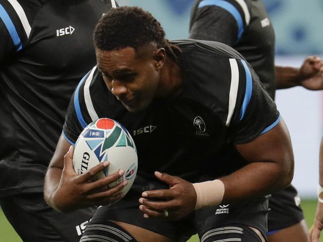 Fiji rugby team player Viliame Mata, 2nd from left, handles the ball during training at the Sapporo Dome before the start of the Rugby World Cup in Sapporo, Northern Japan, Friday, Sept. 20, 2019. Fiji will play against Australia on Saturday Sept. 21 in their first game. (AP Photo/Aaron Favila)