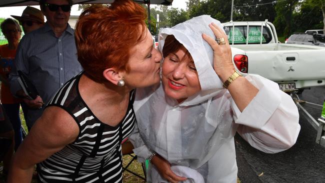 One Nation leader Senator Pauline Hanson and ALP member for Bundamba, Jo-Ann Miller cosy up. Picture: AAP/Darren England