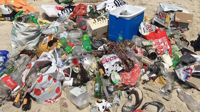 Approximately 200 backpackers have allegedly gathered at an illegal beach party in Byron Bay on the NSW north coast. Pictured is a pile of rubbish left at Belongil Beach following the Boxing Day party. Picture: Supplied