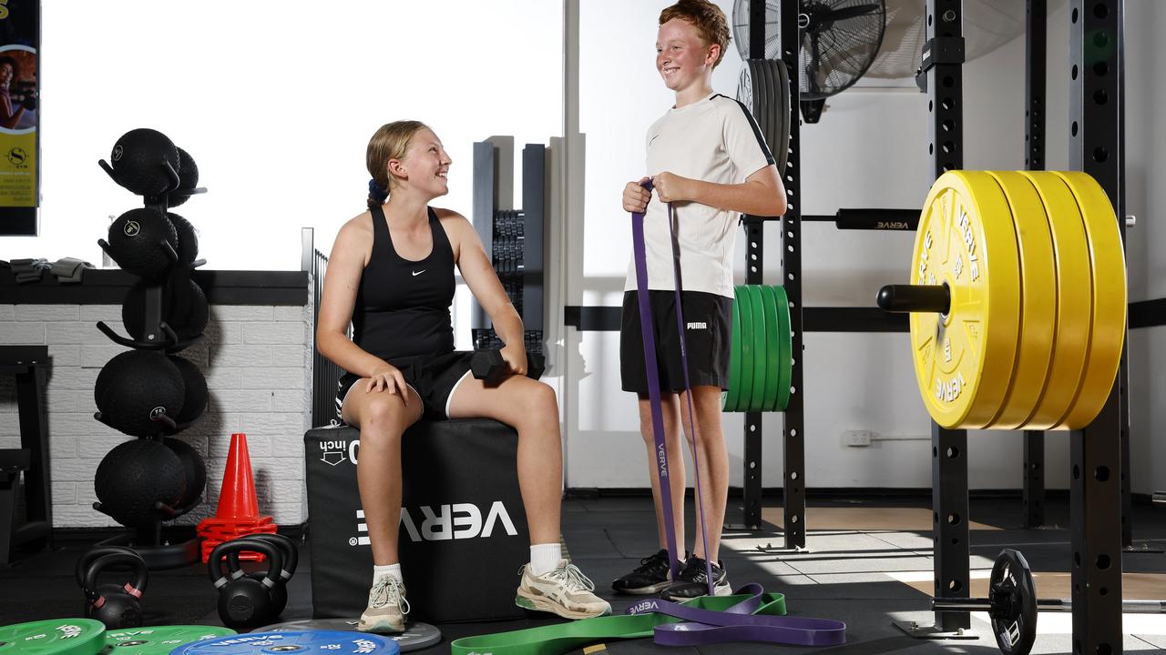 Daisy White, 13 and Tyler Smith, 13 go to the gym in Gymea and benefit from regular strength-building exercises each week. Picture: Jonathan Ng