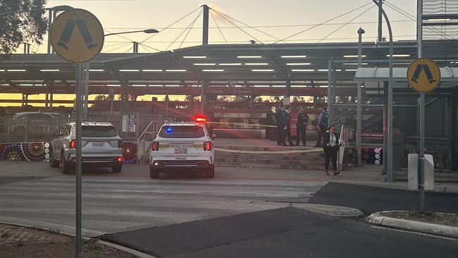 Police at the Elizabeth Interchange after a security guard was stabbed. Picture: Natalie Vikhrov.