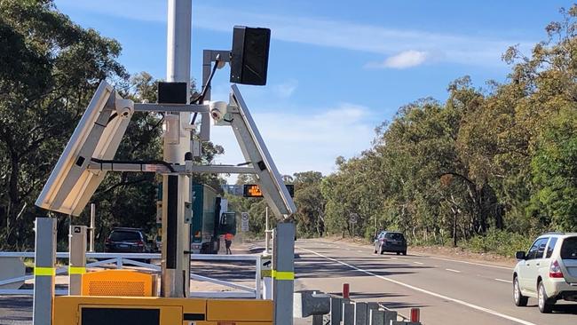 A transportable mobile phone detector camera snapping drivers on Mona Vale Rd at Terrey Hills. Picture: Jim O'Rourke