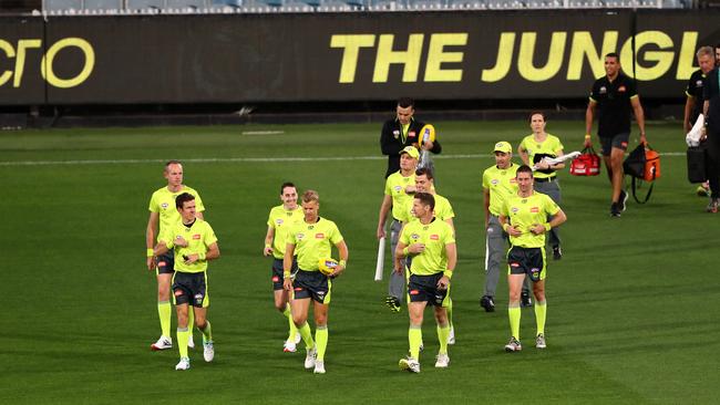 Four AFL umpires will go into 14-day isolation before umpiring the likely Showdown in Round 2. Picture: Getty