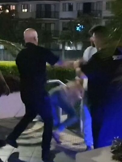 A screenshot of a video of security guards at The Grand Hotel, Labrador in a confrontation with two patrons, who were pushed down a flight of stairs.