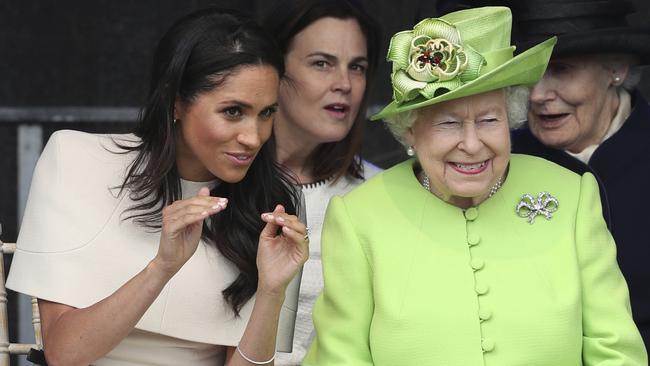 Britain's Queen Elizabeth and Meghan, the Duchess of Sussex, left, attend the opening of the new Mersey Gateway Bridge, in Widnes, north west England, Thursday June 14, 2018. (Danny Lawson/PA via AP)