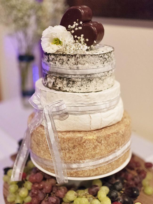 Cheese lovers: Matthew Brunes and Bridget Williams opted for a cheese wheel cake. Picture: iSpy Wedding Photography (Dylan Evans)