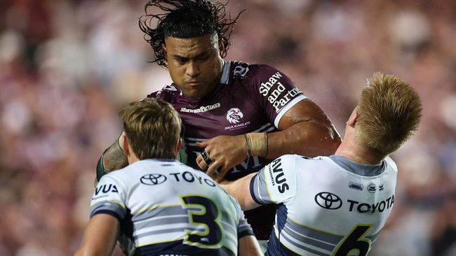 SYDNEY, AUSTRALIA - MARCH 08: HaumoleÃÂ Olakau'atu of the Sea Eagles is tackleduring the round one NRL match between Manly Sea Eagles and North Queensland Cowboys at 4 Pines Park, on March 08, 2025, in Sydney, Australia. (Photo by Cameron Spencer/Getty Images)