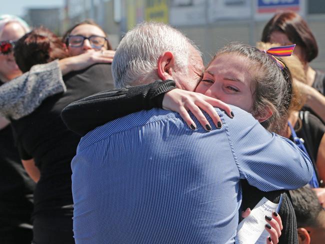 Staff from Spotlight after the tragedy. Picture: Stuart McEvoy