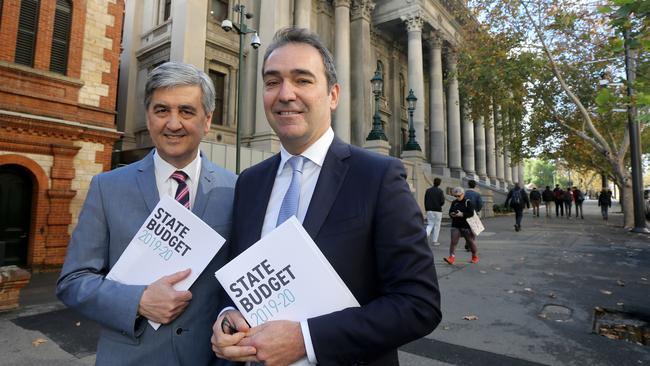 SA Treasurer Rob Lucas and Premier Steven Marshall with a copy of the last state budget, in 2019.. Photo: AAP Image/Kelly Barnes