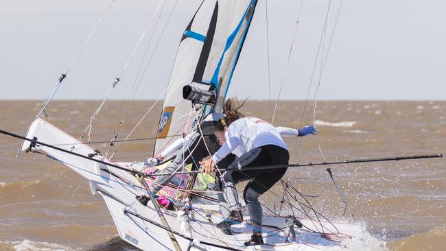 Sailors competing in the muddy brown water in Argentina.