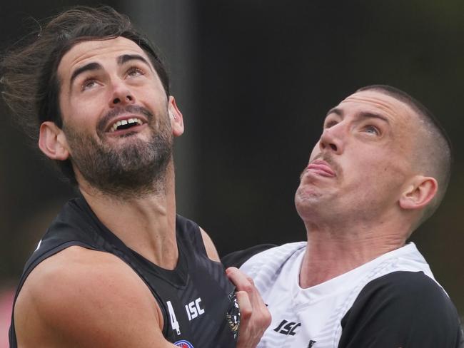 Darcy Cameron and Brodie Grundy of the Magpies compete for the ball during a Collingwood Magpies AFL training session at Olympic Park, in Melbourne, Monday, June 1, 2020. (AAP Image/Michael Dodge) NO ARCHIVING