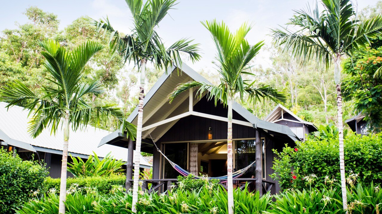 <h2><span>Palm Bungalows</span></h2><p><span>There&rsquo;s a slight price jump here with the bungalows starting at $480 a night. Although the rooms accommodate up to four people, they are better suited to couples who yearn for a more isolated feel in lush gardens. There is a kitchenette, microwave, fridge and tea/coffee equipment if you want to make your own food - check out the island&rsquo;s own IGA - but like the Reefview, the Bungalows falls under 'the kids stay and eat free' program (for under 12s). You also get access to most of the resort pools, the complimentary shuttle service, airport/marina transfers, free in room wifi and you can also book a treatment at the Spa Wumurdaylin and Island Hair &amp; Beauty. Finally, you can also make use of the fitness centre, kids club and free non motorised watersports equipment.&nbsp;&nbsp;</span></p><p class="button-common"><a title="https://go.skimresources.com?id=145349X1636243&amp;xs=1&amp;url=https%3A%2F%2Fwww.hamiltonisland.com.au%2Faccommodation%2Fpalm-bungalows-resort" href="https://go.skimresources.com?id=145349X1636243&amp;xs=1&amp;url=https%3A%2F%2Fwww.hamiltonisland.com.au%2Faccommodation%2Fpalm-bungalows-resort" target="_blank" data-cta="https://go.skimresources.com?id=145349X1636243&amp;xs=1&amp;url=https%3A%2F%2Fwww.hamiltonisland.com.au%2Faccommodation%2Fpalm-bungalows-resort" data-editable="true">Book here</a></p>