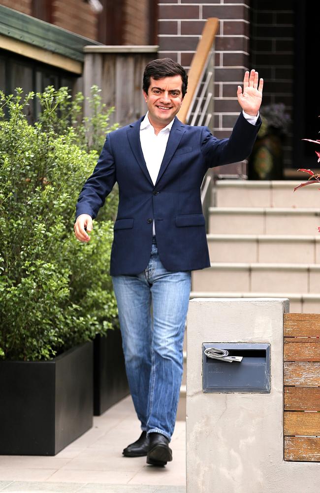 Sam Dastyari leaves home this morning to take his children to school after resigning from the front bench. Picture: John Grainger