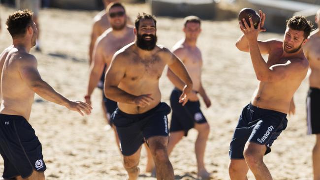 Scotland rugby players during a recovery session at Coogee Beach on Monday.