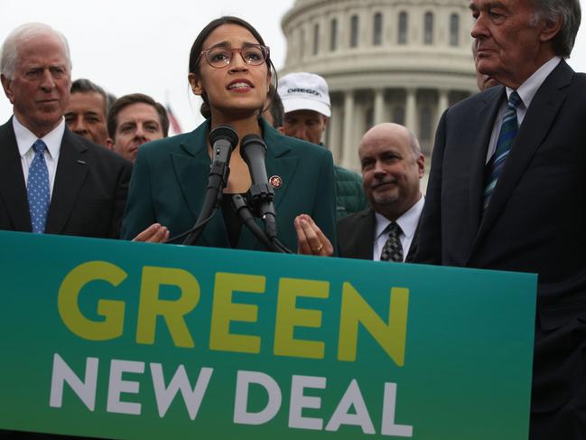 WASHINGTON, DC - FEBRUARY 07: U.S. Rep. Alexandria Ocasio-Cortez (D-NY) speaks as Sen. Ed Markey (D-MA) (R) and other Congressional Democrats listen during a news conference in front of the U.S. Capitol February 7, 2019 in Washington, DC. Sen. Markey and Rep. Ocasio-Cortez held a news conference to unveil their Green New Deal resolution.   Alex Wong/Getty Images/AFP == FOR NEWSPAPERS, INTERNET, TELCOS & TELEVISION USE ONLY ==