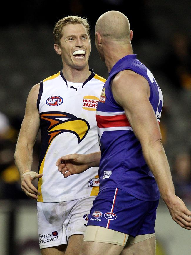 Selwood squares up to Barry Hall during a game.