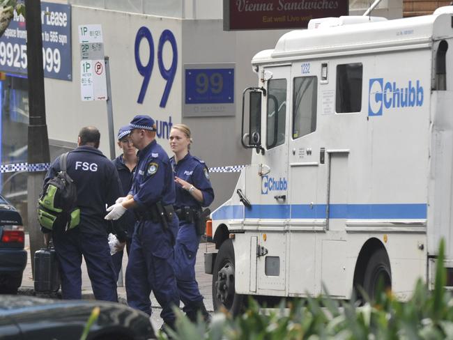 Police investigating the armoured van robbery at North Sydney in 2009.