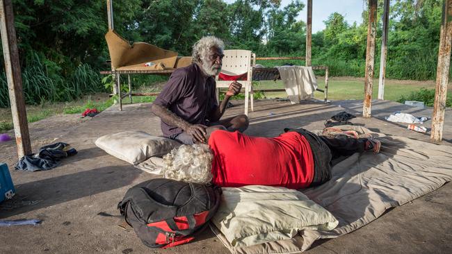 Men shelter at One Mile Dam near Darwin's CBD. Picture: Jake Nowakowski