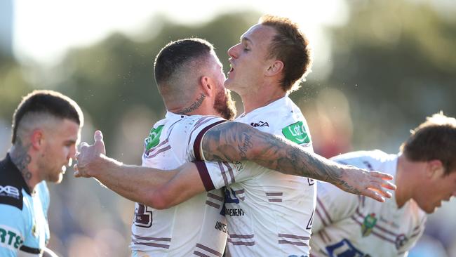 Manly's Joel Thompson celebrates after scoring a try with Manly's Daly Cherry-Evans. Picture: Brett Costello