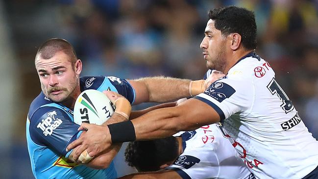 Keegan Hipgrave of the Titans is tackled during the round 25 NRL match between the Gold Coast Titans and the North Queensland Cowboys at Cbus Super Stadium on September 1, 2018. Picture: Chris Hyde/Getty Images)