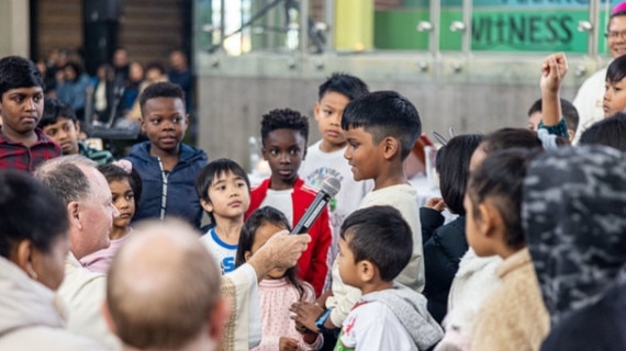 Young churchgoers during Mass at St Luke's Catholic College, Marsden Park.