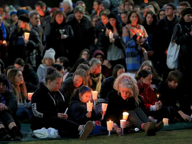 Mourners with candles at a vigil for Eurydice Dixon. Picture: Mark Stewart