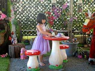 FAIRY LAND: Abbey Joyce Tydd loves the fairy garden her parents built for her. Picture: Jann Houley