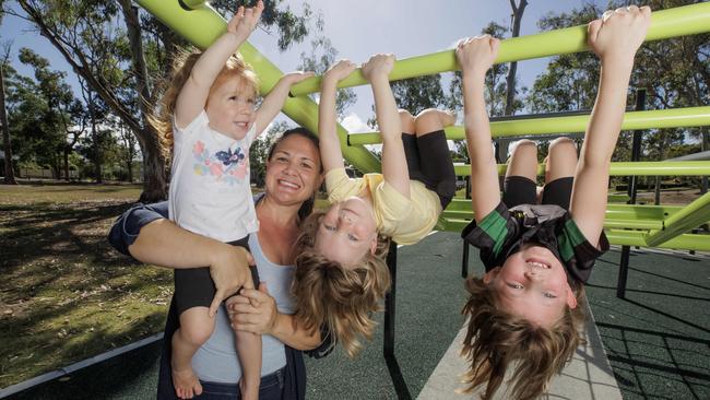 Brisbane mum Tegan Seccombe with daughters Hollie, 2, Hannah, 4, and Alicia, 6. Photo: Lachie Millard.