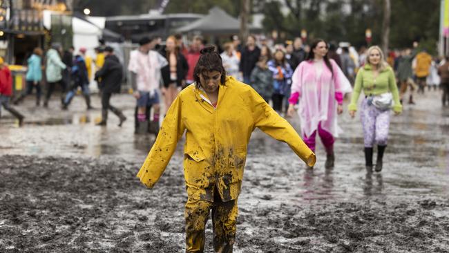 BYRON BAY, AUSTRALIA - JULY 22: A festival goer is seen in mud during Splendour in the Grass 2022 at North Byron Parklands on July 22, 2022 in Byron Bay, Australia. Festival organisers have cancelled the first day of performances at Splendour in the Grass due to heavy rain at the festival site. (Photo by Matt Jelonek/Getty Images)