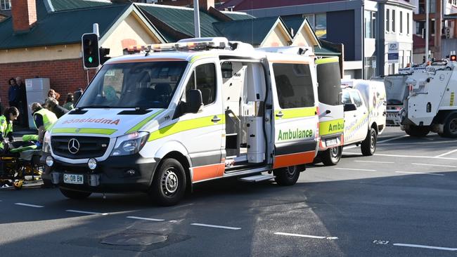 A cyclist has been rushed to hospital after colliding with a car on the intersection of Warwick Street and Harrington Street. Picture: Kenji Sato