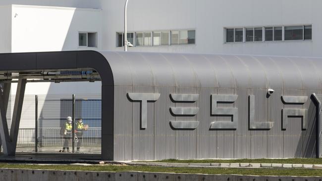 Workers walk through the Tesla Inc. Gigafactory in Shanghai, China. Photo: Qilai Shen/Bloomberg