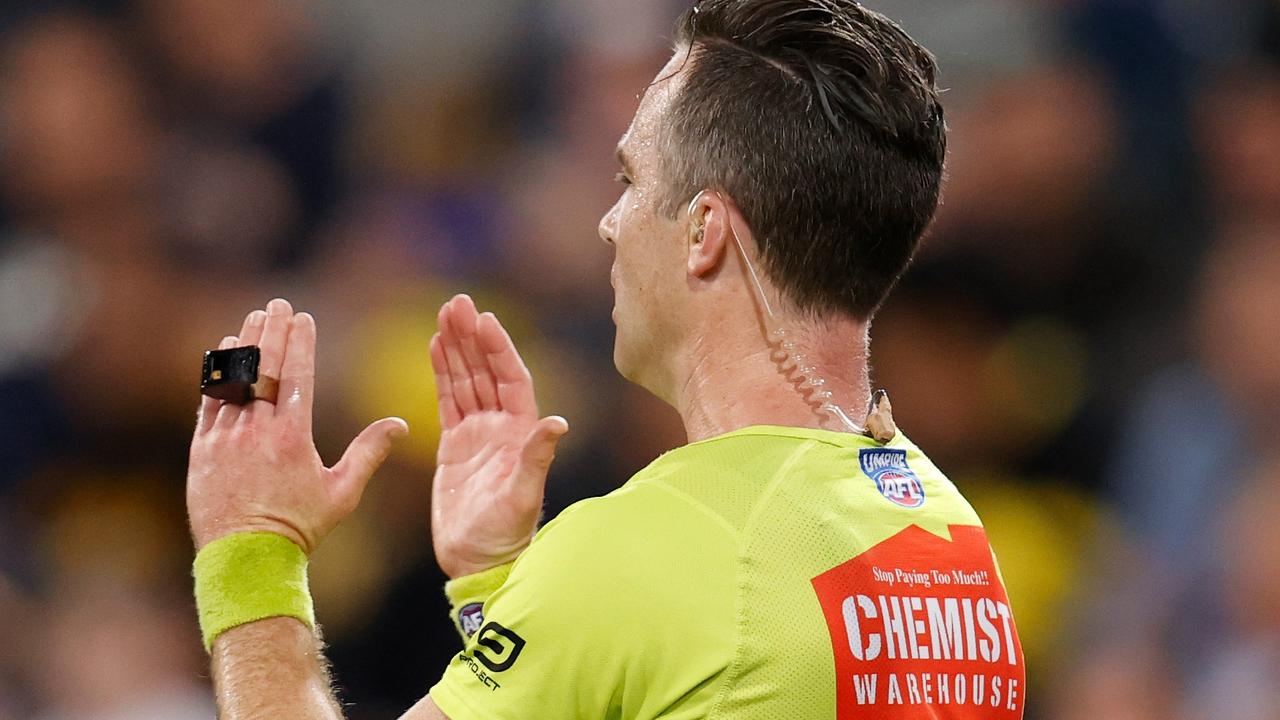 AFL umpire Jacob Mollison calls for a video review after Tom Lynch’s controversial set shot. Picture: Michael Willson/AFL Photos via Getty Images