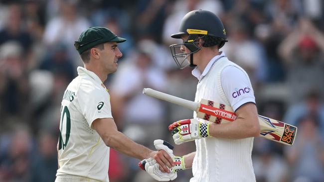 Zak Crawley of England shakes hands with Australia captain Pat Cummins as he leaves the field after being dismissed. Picture: Getty Images.