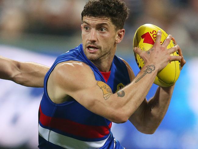 AFL Round 9. 18/05/2019. Geelong v Western Bulldogs at GMHBA Stadium..   Bulldog Tom Liberatore  evades Geelongs Mark O'Connor  3rd quarter    . Pic: Michael Klein.